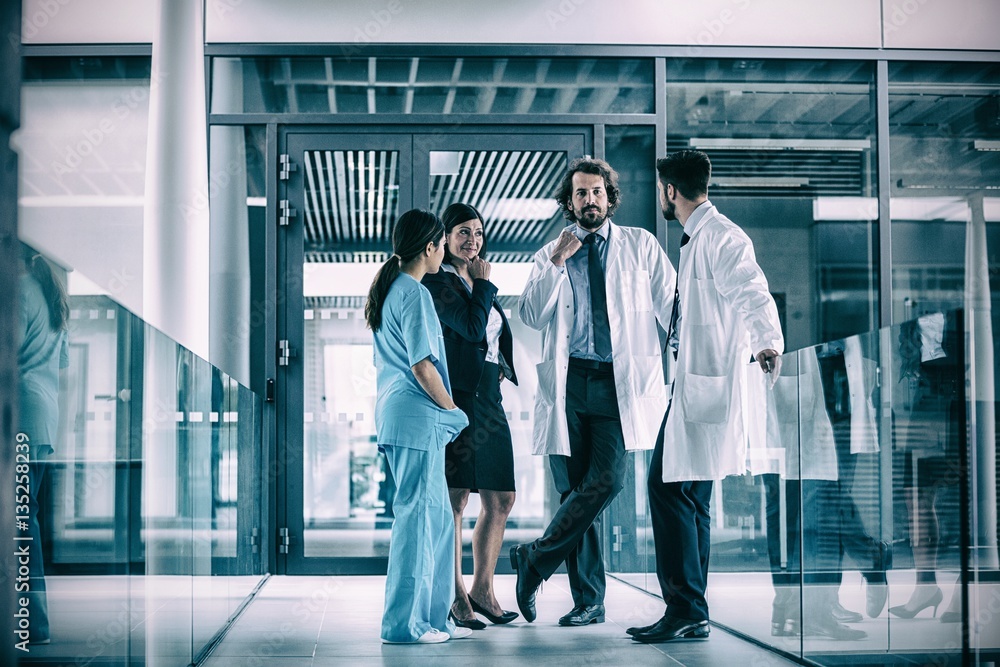 Businesswoman interacting with doctors