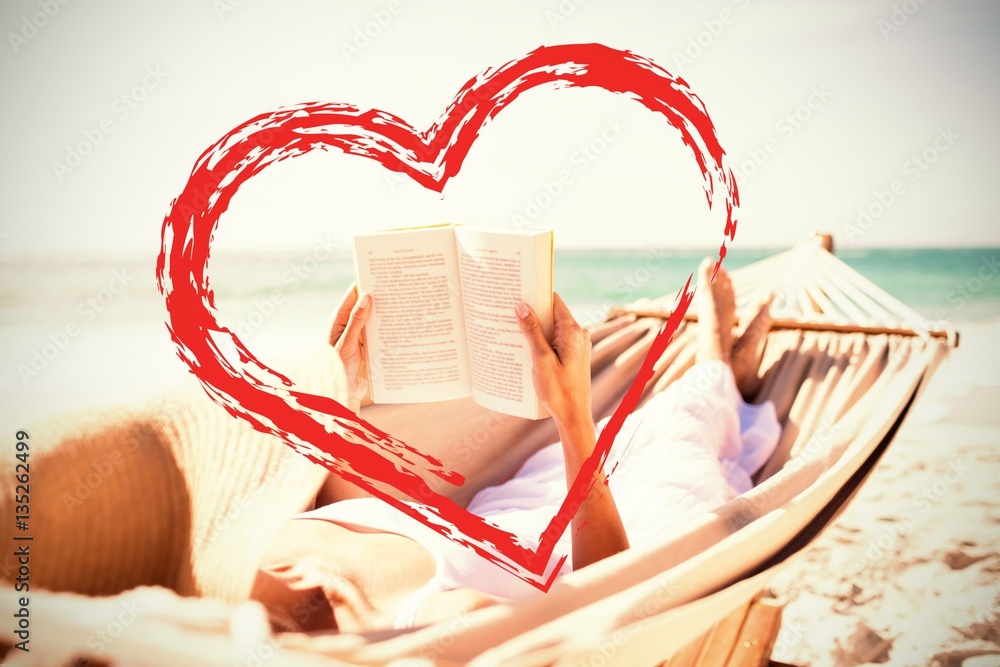 Composite image of woman reading book on hammock at beach