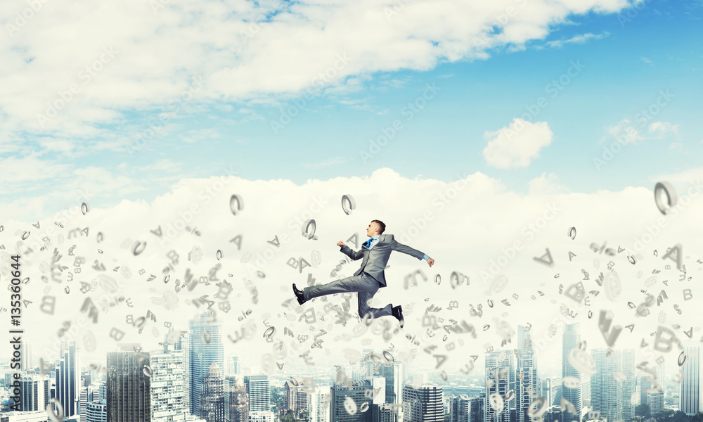 Businessman jumping high