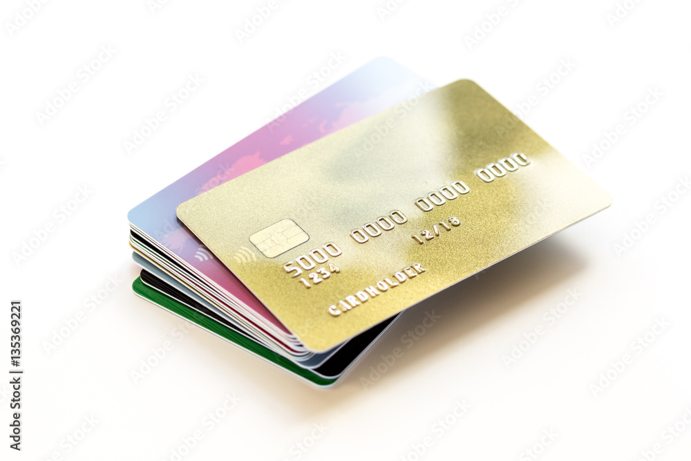 pile of credit cards on white background