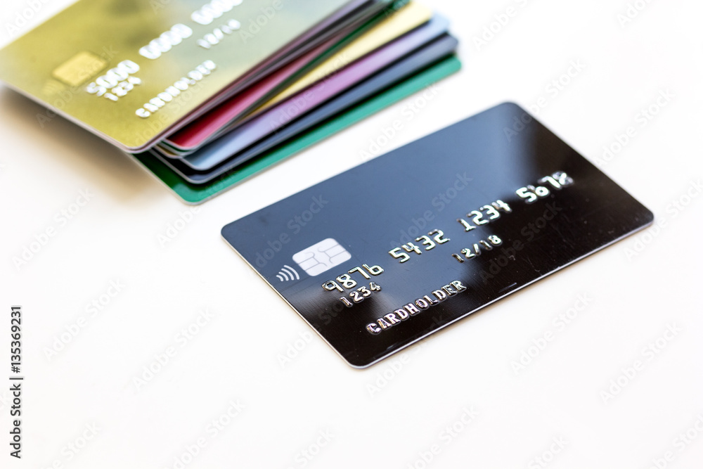 pile of credit cards on white background