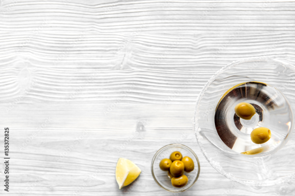 martini and shaker top view of wooden background