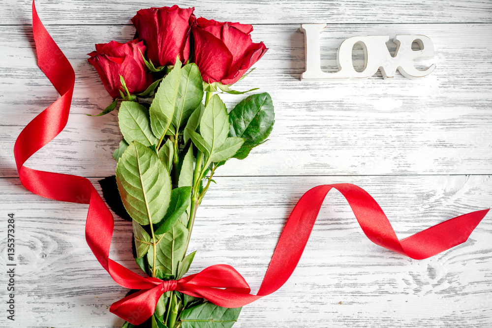 concept Valentines Day with flower wooden background top view