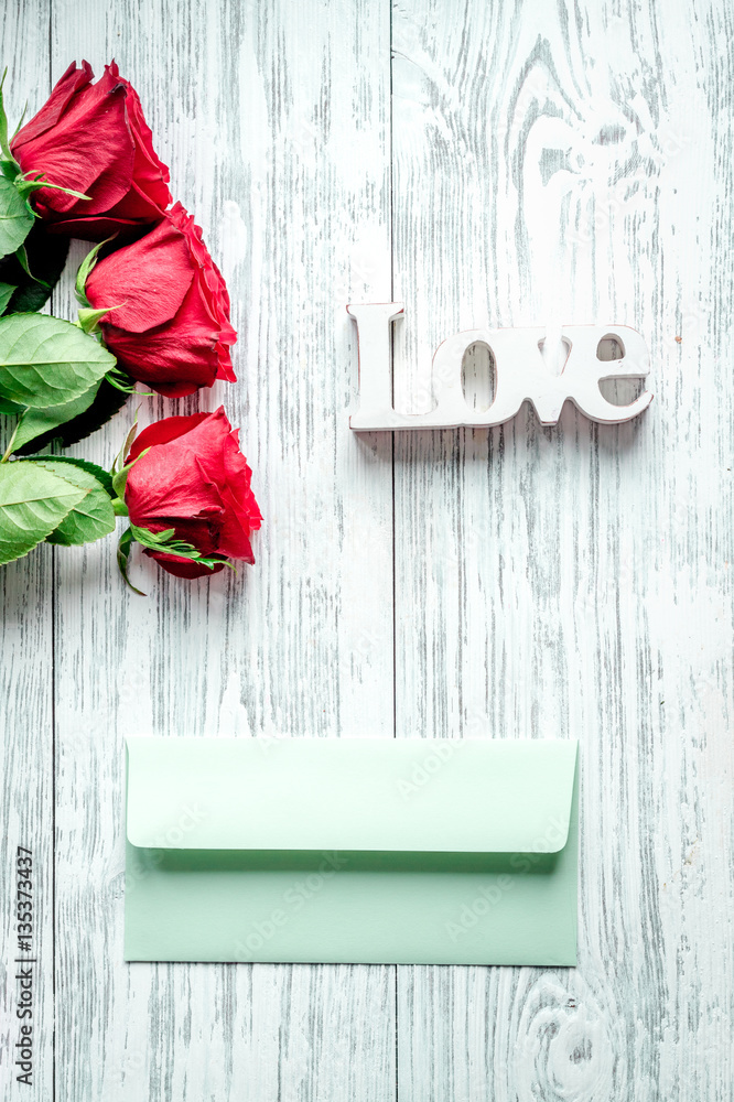 concept Valentines Day with flower wooden background top view