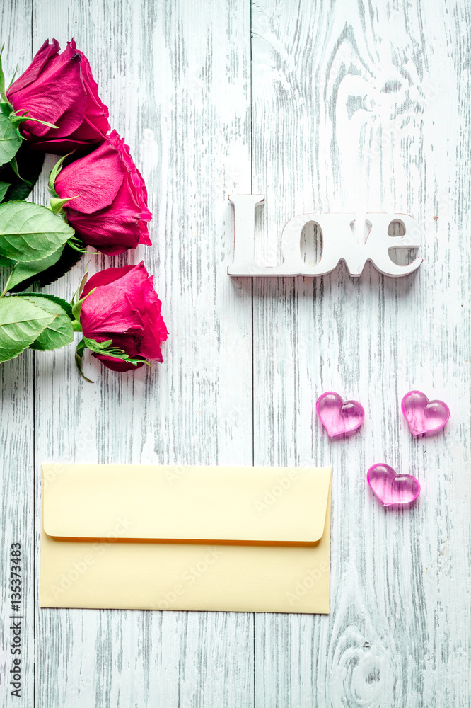 concept Valentines Day with flower wooden background top view