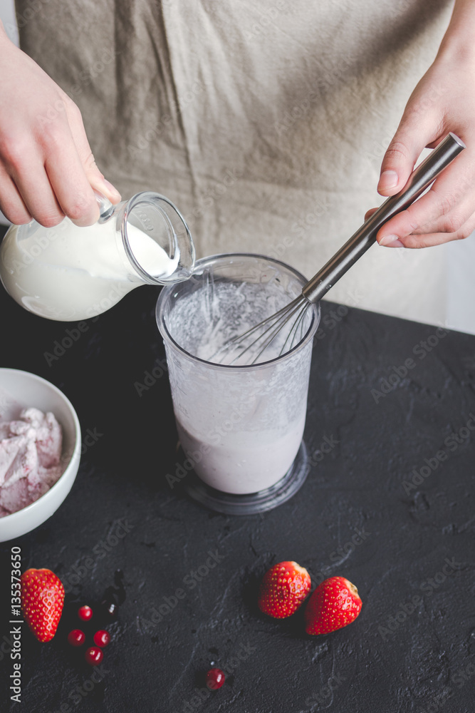 organic ice cream homemade process on dark background with hands