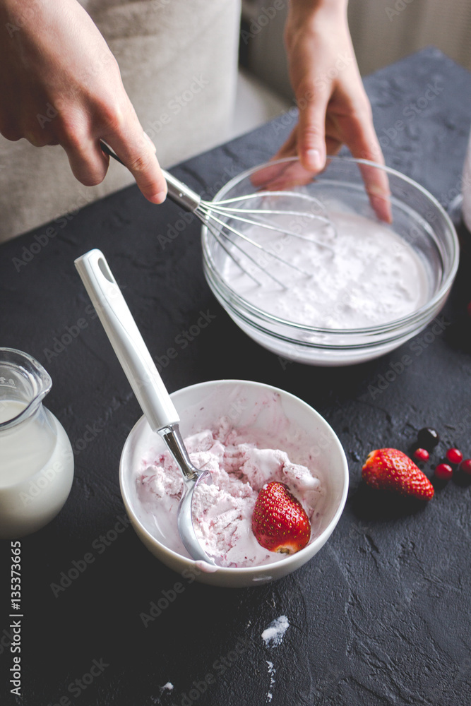 organic ice cream homemade process on dark background with hands