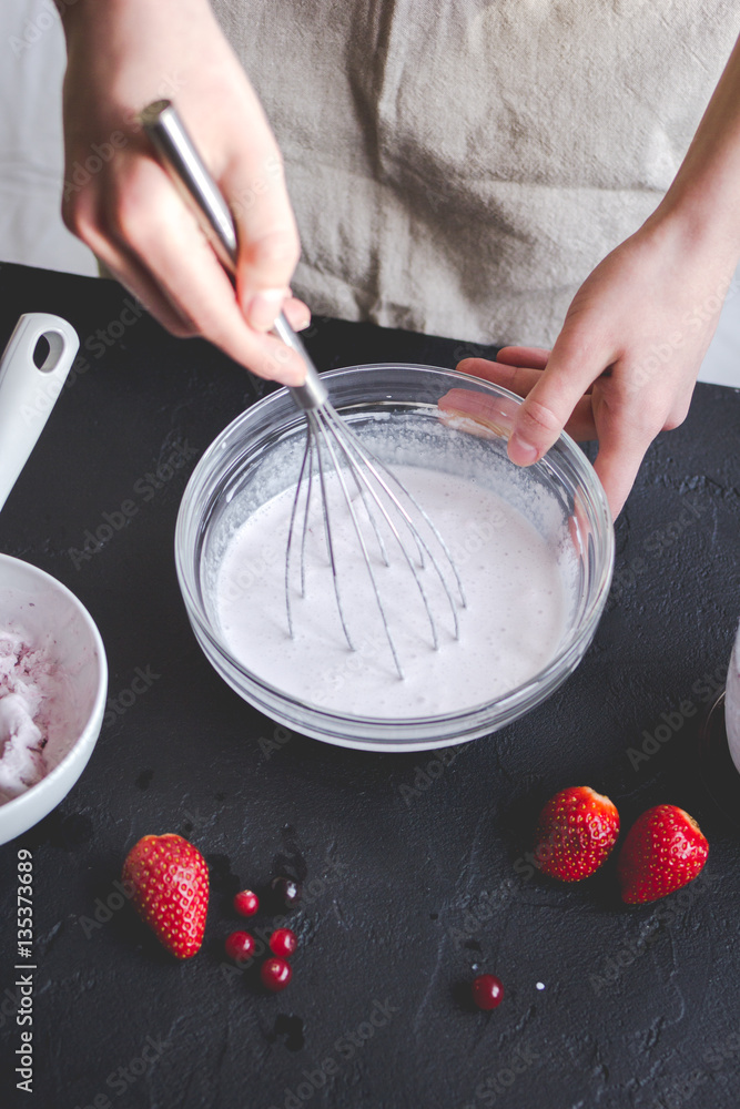 organic ice cream homemade process on dark background with hands