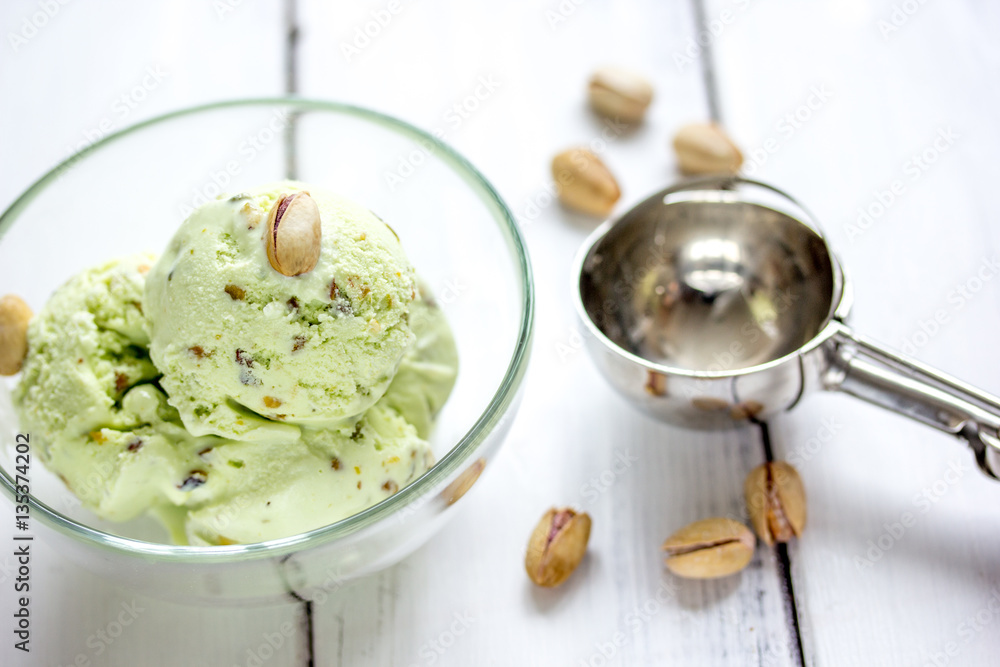 organic homemade ice cream in glass bowl on wooden background