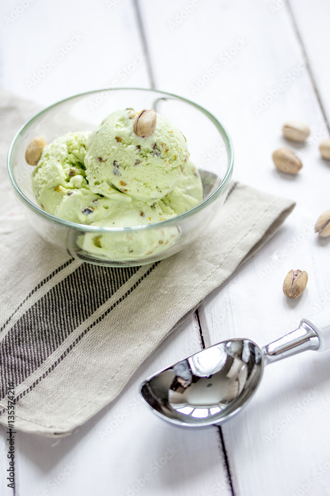 organic homemade ice cream in glass bowl on wooden background