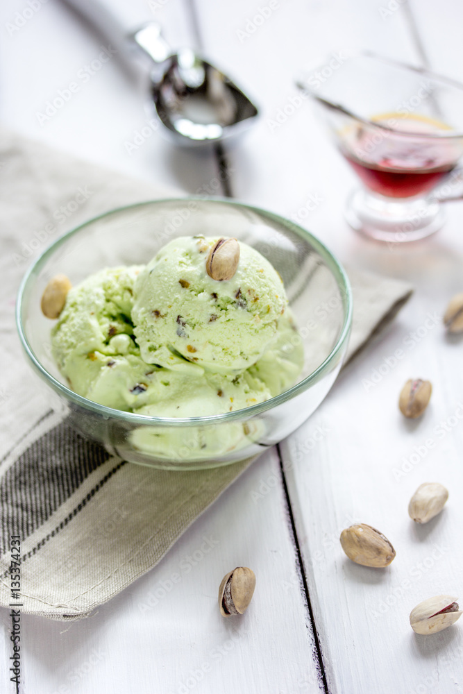 organic homemade ice cream in glass bowl on wooden background