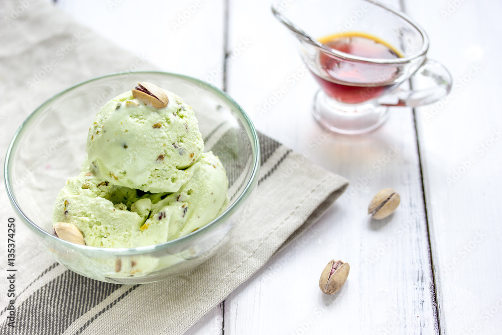 organic homemade ice cream in glass bowl on wooden background