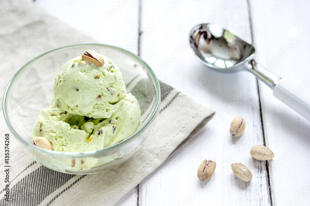 organic homemade ice cream in glass bowl on wooden background