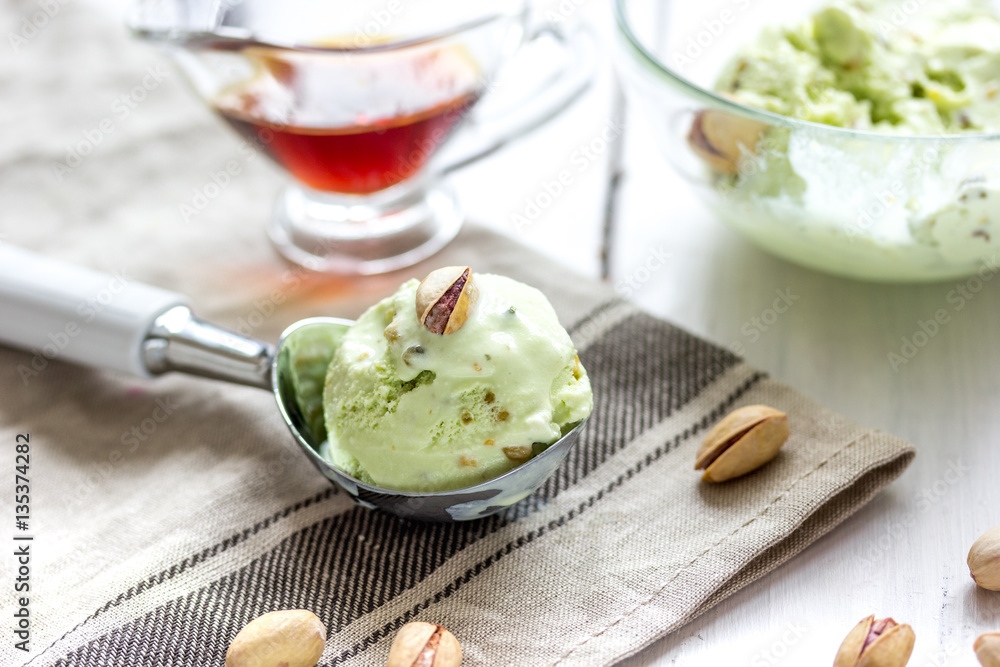 organic homemade ice cream in glass bowl on wooden background