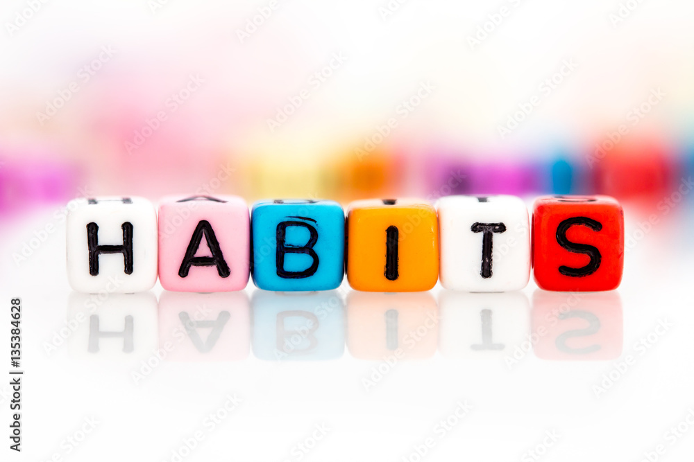 colorful word cube of habits on white background