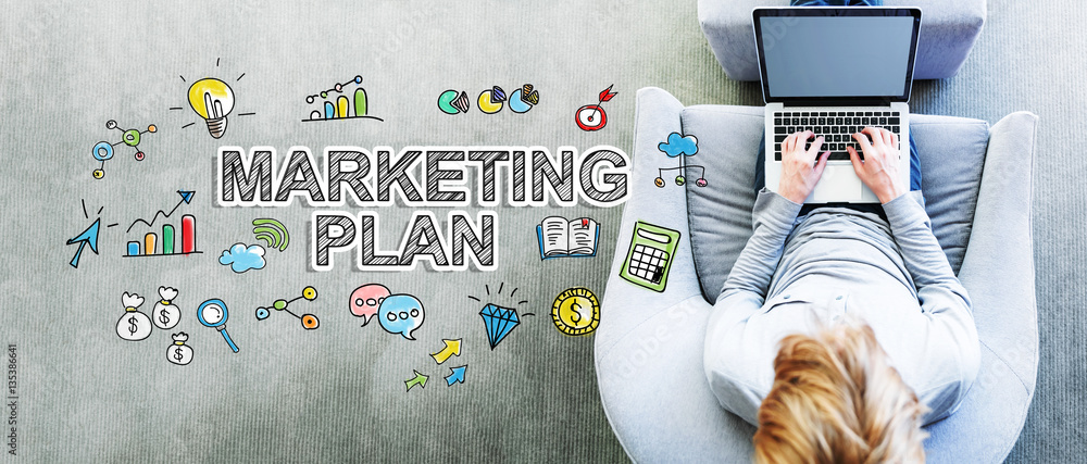 Marketing Plan text with man using a laptop