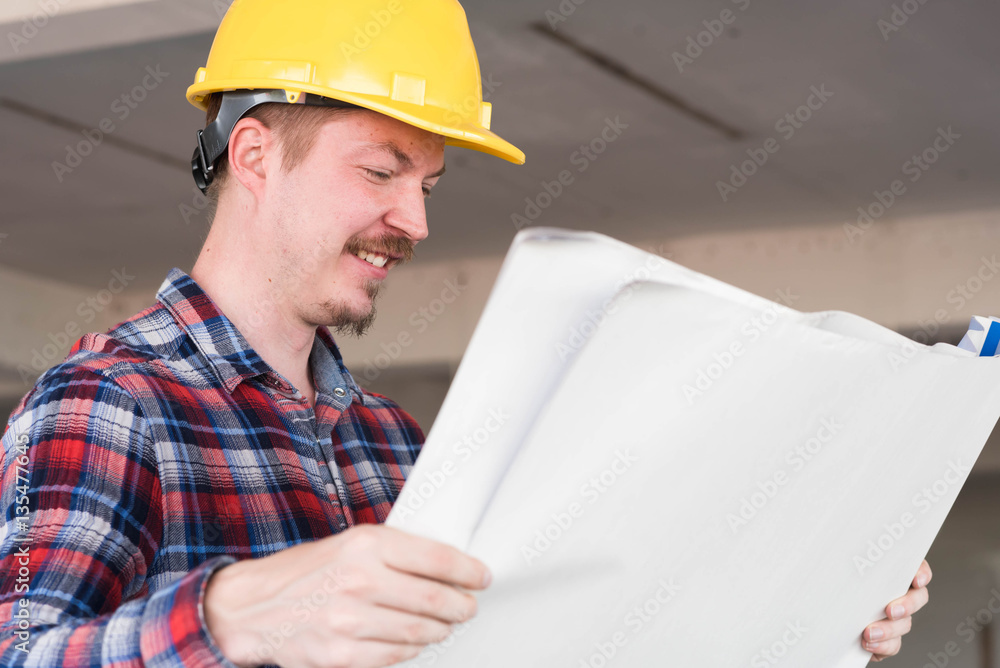 Westerner Construction engineer smile wear yellow safety helmet