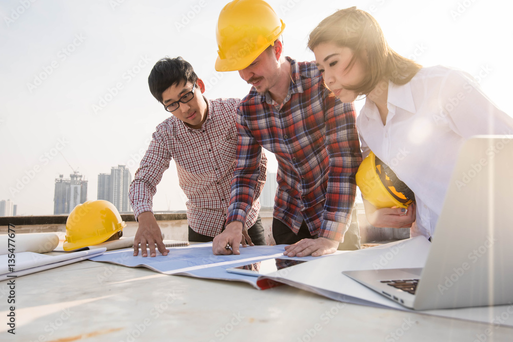 three construction engineers working outdoors in construction si