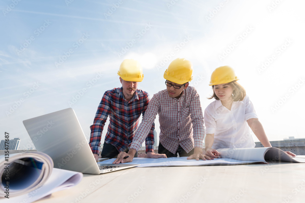 three construction engineers working outdoors in construction si