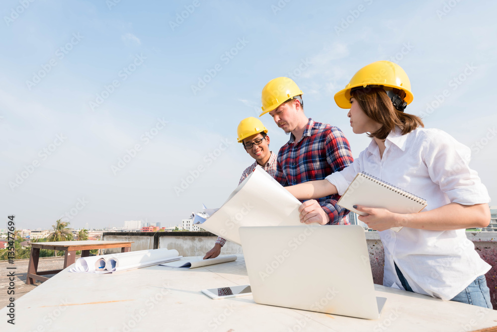 three construction engineers working outdoors in construction si