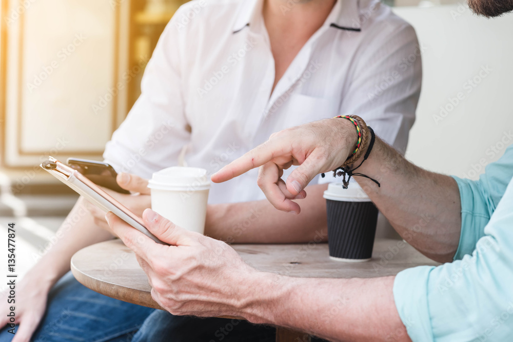 Two Westerner Business men working with laptop, tablet and smart