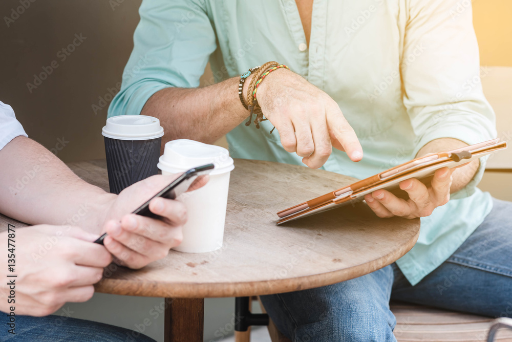 Two Westerner Business men working with laptop, tablet and smart