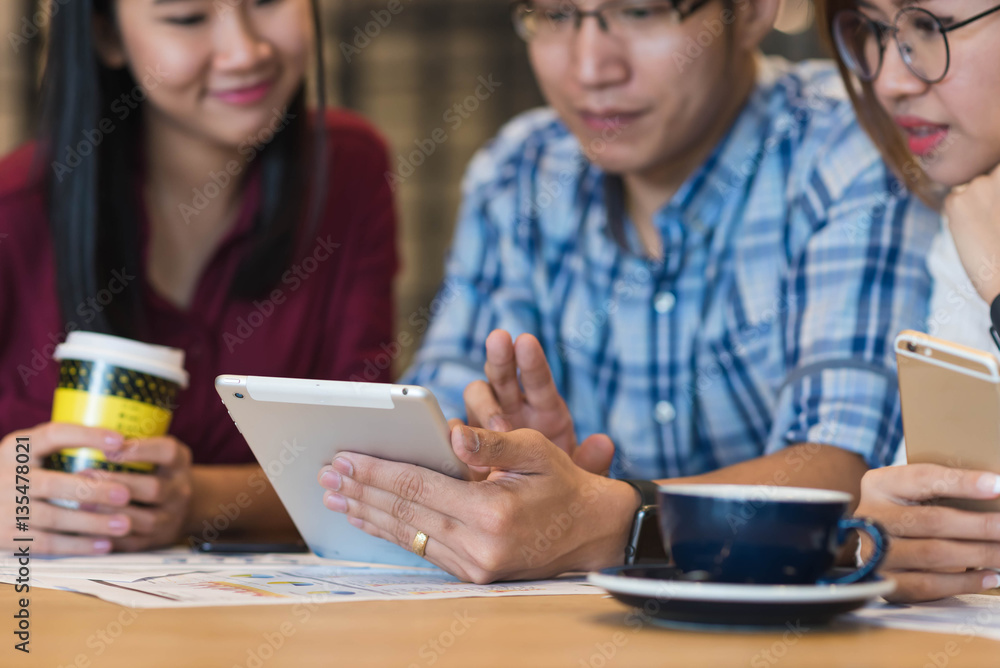 Hand of man using tablet with friends, internet of things concep