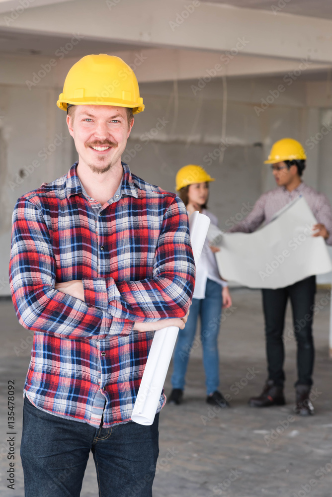 Construction engineer smile wear yellow safety helmet with blue