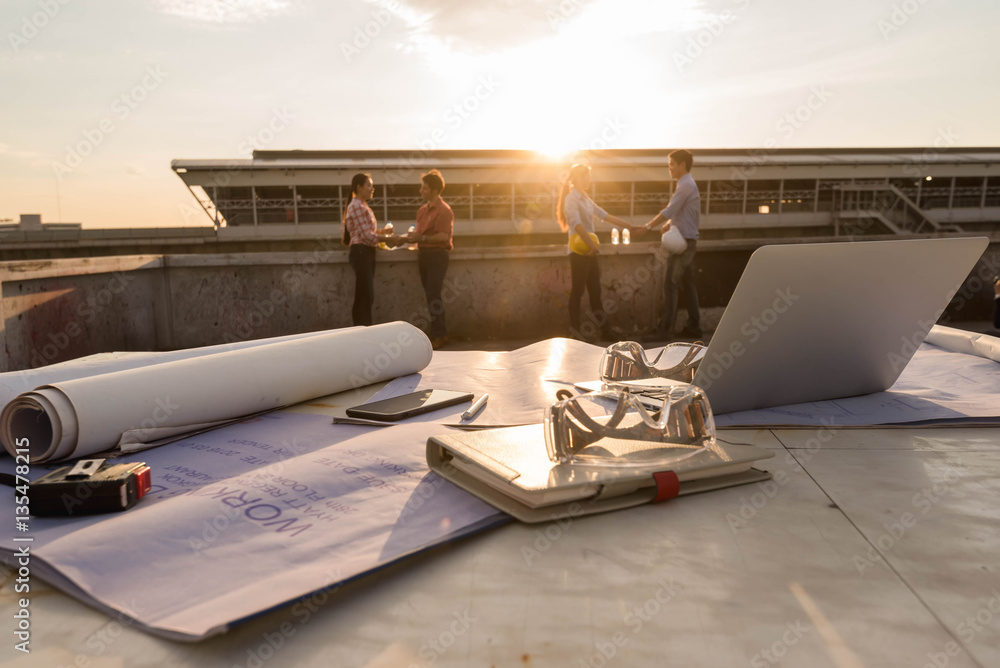 Work desk of construction engineer outdoor at after work days