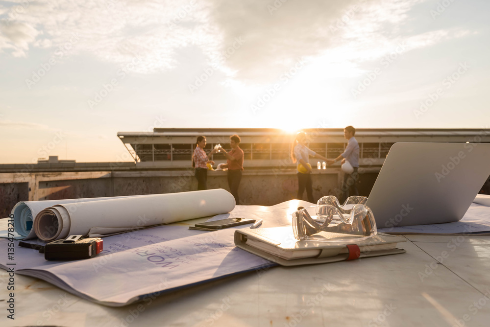 Work desk of construction engineer outdoor at after work days