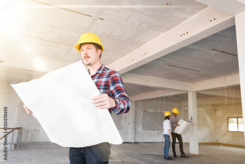 Westerner Construction engineer smile wear yellow safety helmet