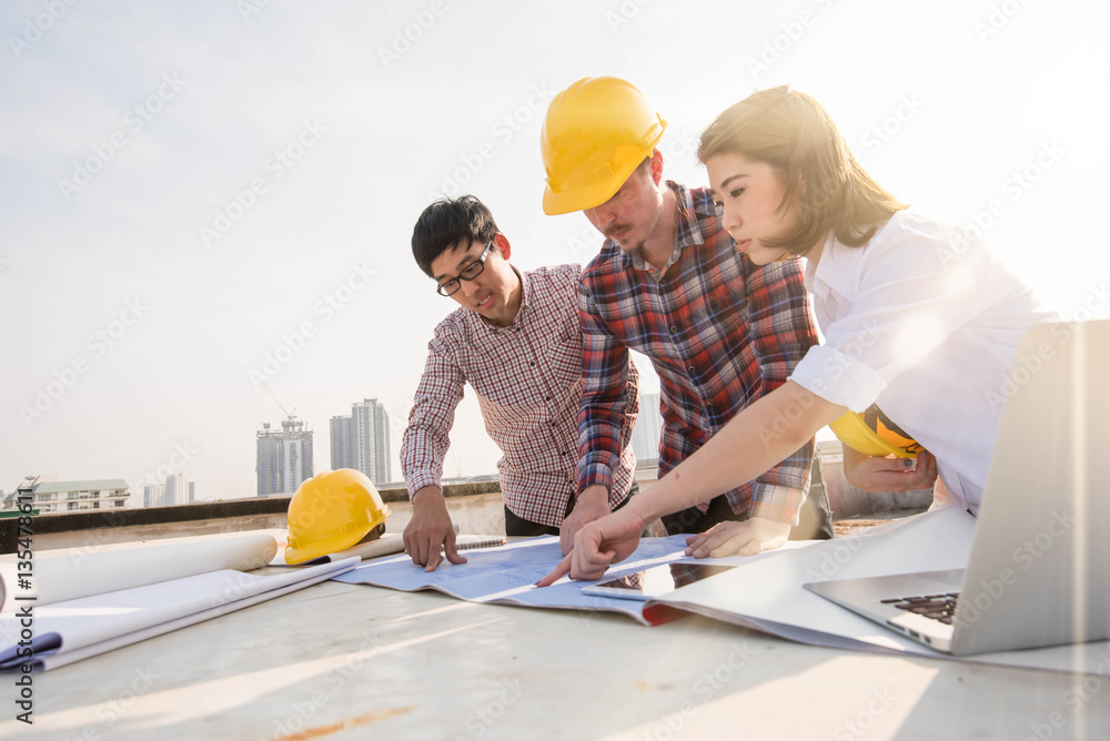 three construction engineers working outdoors in construction si