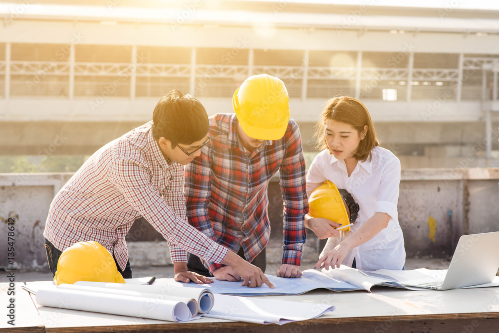 three construction engineers working outdoors in construction si