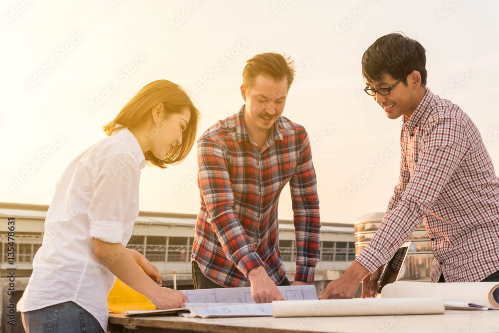 three construction engineers working outdoors in construction si