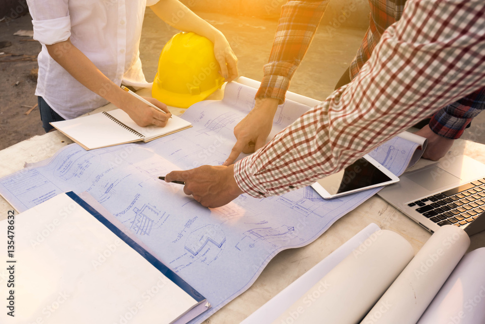 three construction engineers working outdoors in construction si