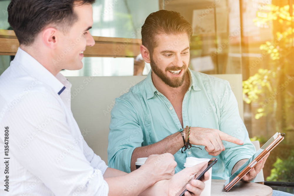 Two westerner man meet use smartphone