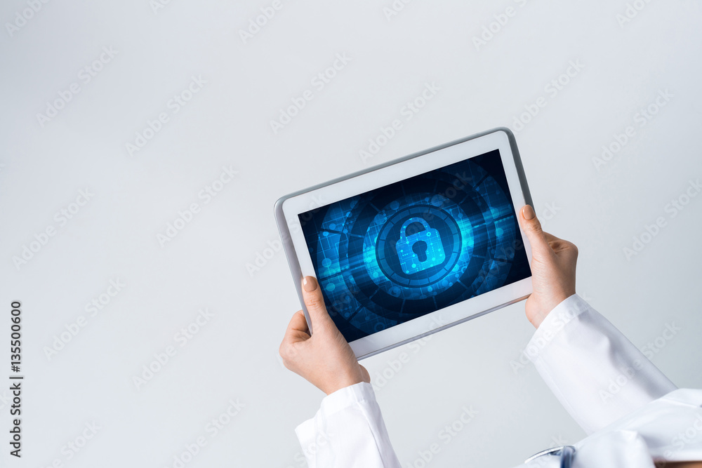 Close of female doctor hands working with tablet pc computer