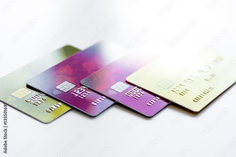 pile of credit cards on white background