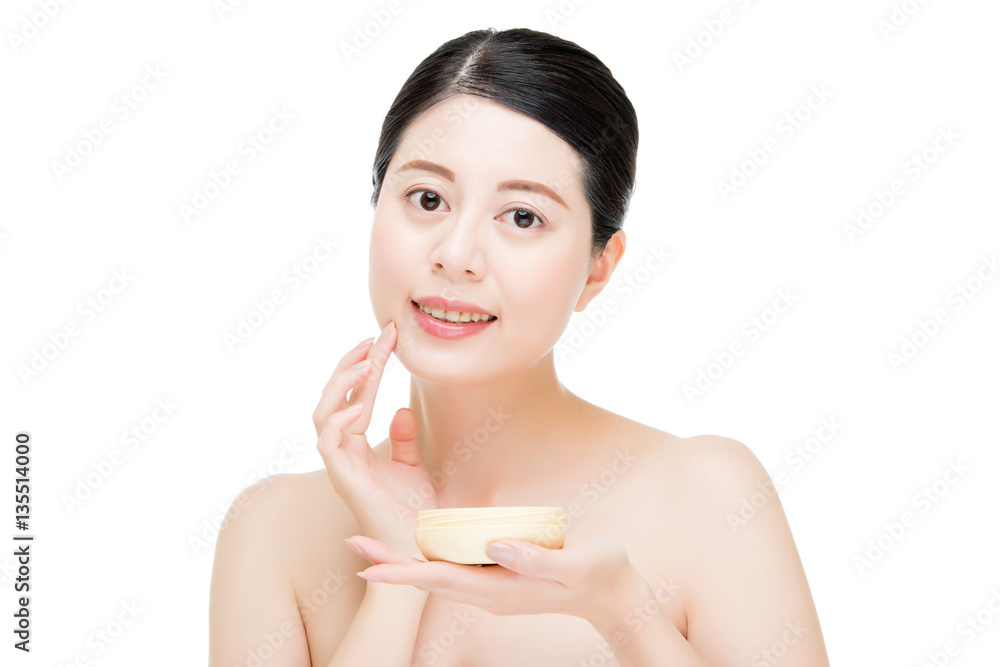 beauty asian woman applying facial lotion product on face