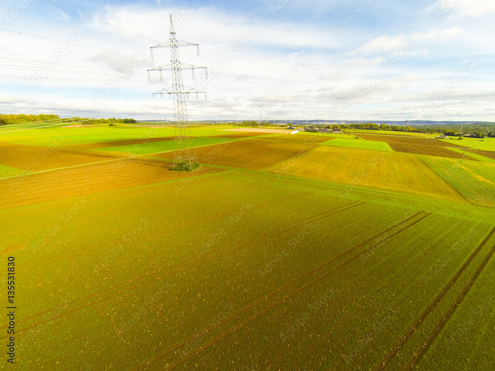 Aerial View Of Fields And Electrical Tower