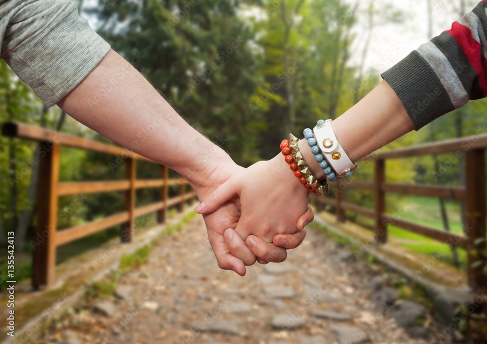 Couple holding hands