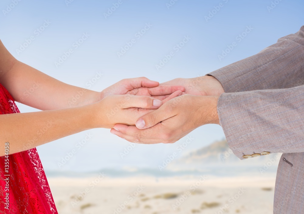 Man holding cupped hands of woman