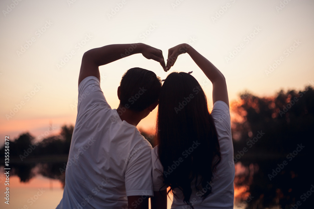 Couple in love holding hearts.