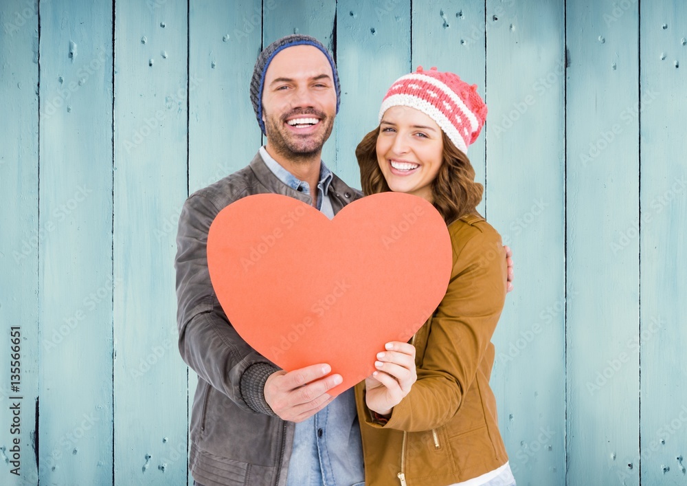 Romantic couple holding a heart