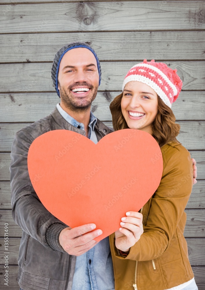 Romantic couple holding a heart