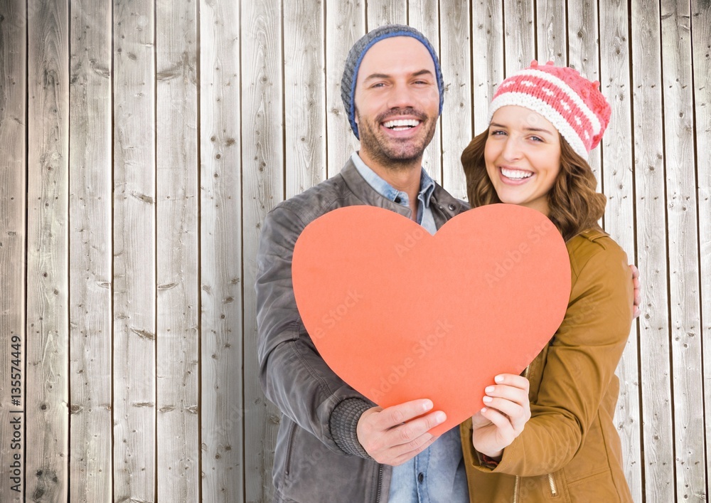 Romantic couple holding a heart