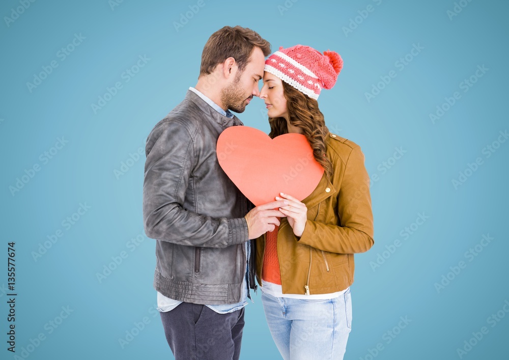 Romantic couple holding a heart