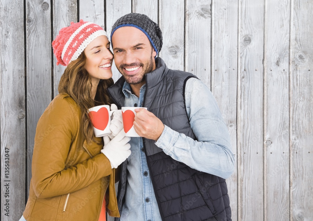 Romantic couple holding coffee mugs