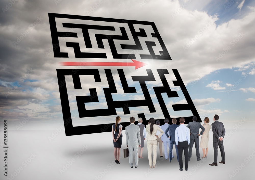 Businesspeople standing and looking at maze