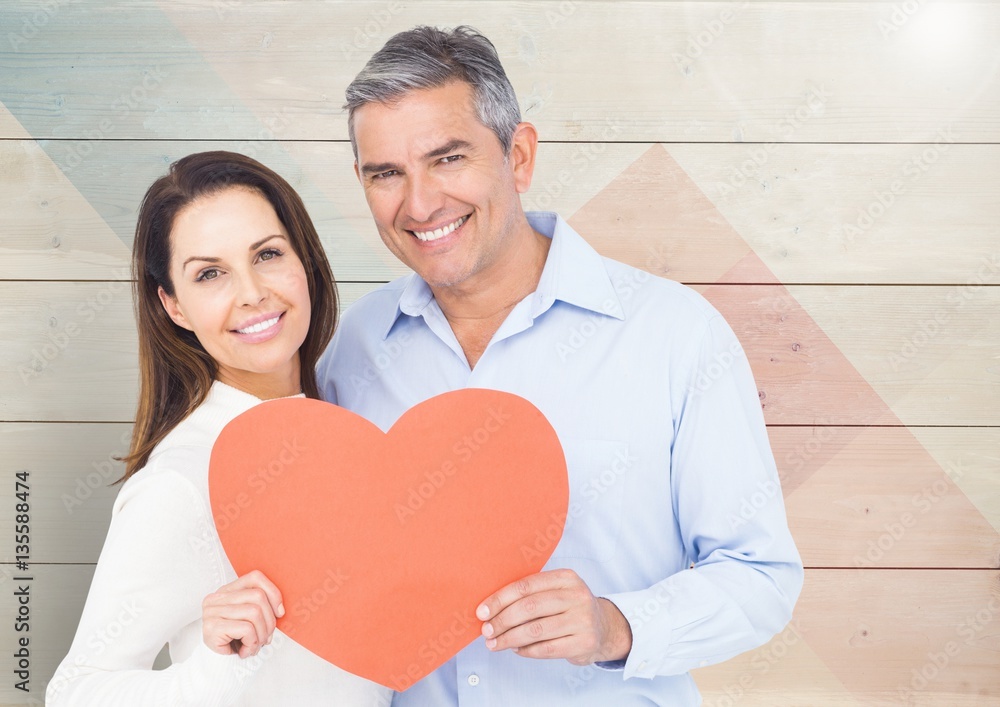 Mature couple holding a heart